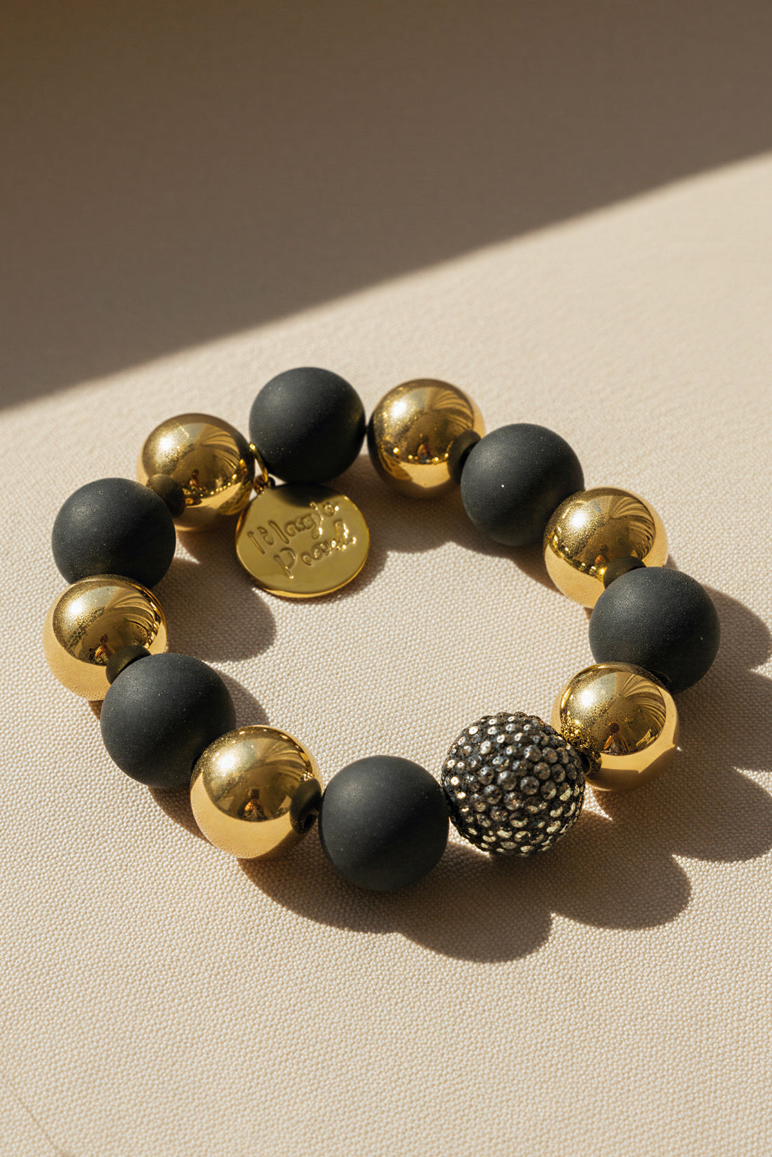 Perlenarmband Schwarz-Gold