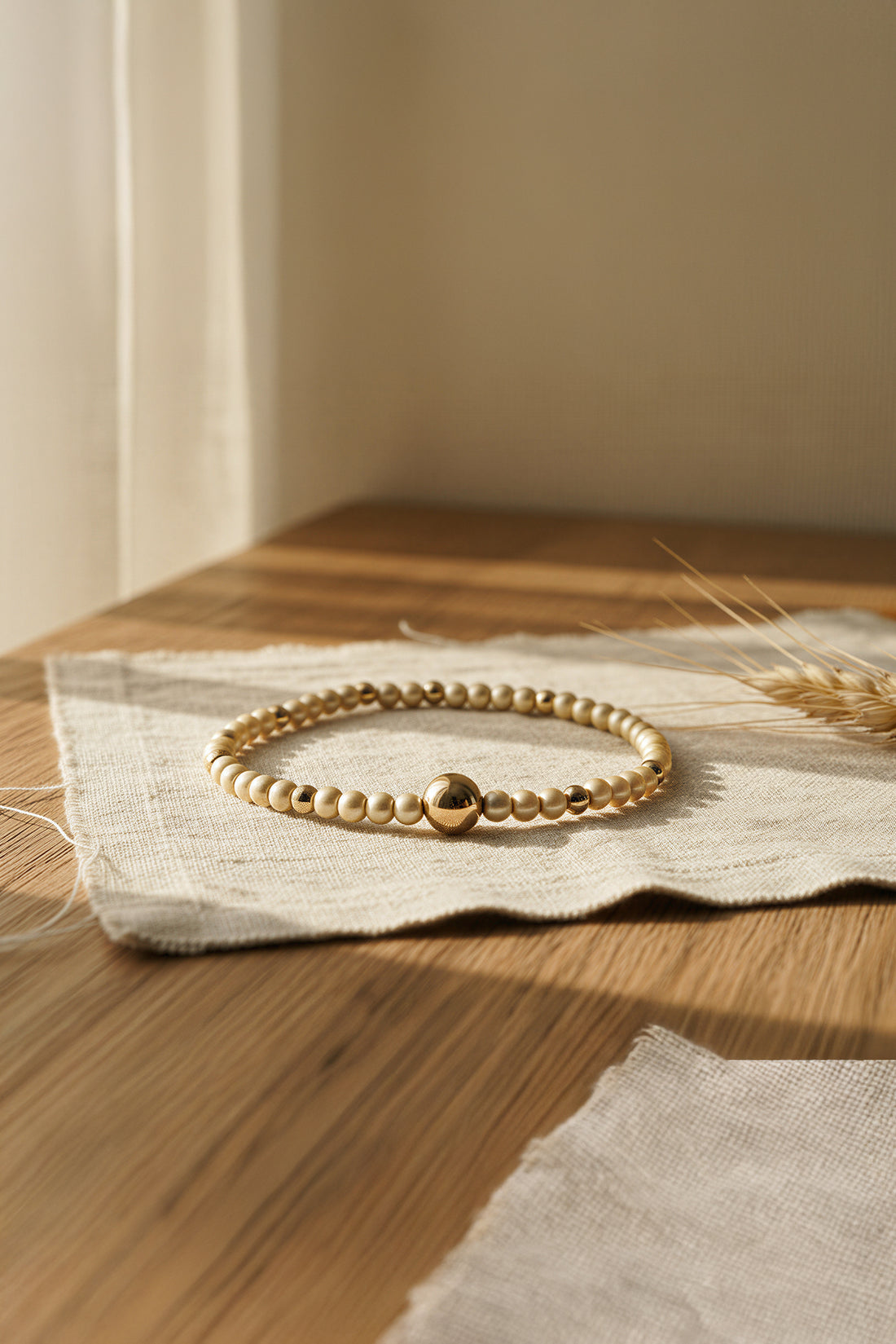 Perlenarmband, champagner und gold