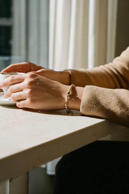 Perlenarmband, champagner und gold